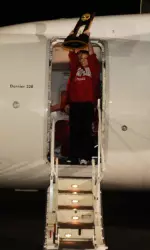 Senior All-American Kayla Hoffman shows off the Crimson Tide's fifth NCAA Championship trophy to the crowd that assembled to greet the 2011 national champions upon their return to Tuscaloosa.