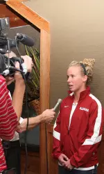 Senior setter Stephanie Riley talks about the upcoming season with reporters at media luncheon.