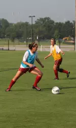 K.K. Duffy and Theresa Diederich take to the field Wednesday morning.
