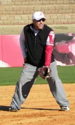 Head coach Patrick Murphy instructs his infielders during practice Sunday.