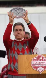 Nick Saban is the first coach to raise the crystal football three times during his coaching career, including two at Alabama.