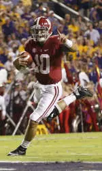 AJ McCarron scored his first rushing touchdown of the season on a nine-yard run to give Alabama a 14-3 lead with 11 seconds left in the second quarter.