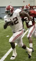 Eddie Lacy tries to elude C.J. Mosley at an indoor practice.