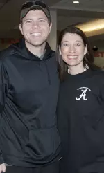 Assistant gymnastics coach and ReadBAMARead co-founder Dana Duckworth with Tuscaloosa Mayor Walt Maddox during Saturday's event.