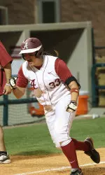 Jackie Traina celebrates after hitting her walk-off home run in game one.