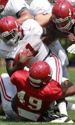 Dee Hart pounds it up the middle for some hard-earned yards.