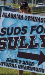 The gymnasts held a fundraising car wash that saw several dozen vehicles come clean with the Crimson Tide.