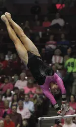 Junior Sarah DeMeo is ranked eighth on the unven bars.