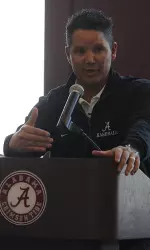 Fourth-year Alabama head coach Mitch Gaspard talking to the fans at the Grand Slammers BBQ
