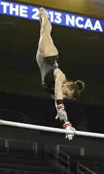 Junior All-American Sarah DeMeo soars on the uneven bars during Thursday's practice day.