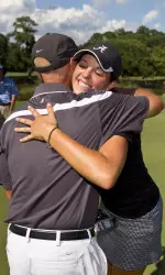 Emma Talley and Alabama head coach Mic Potter embrace following her victory at the U.S. Women's Amateur Championship on Sunday.