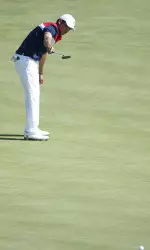 Cory Whitsett watches a putt on 16 Sunday morning just lip out.