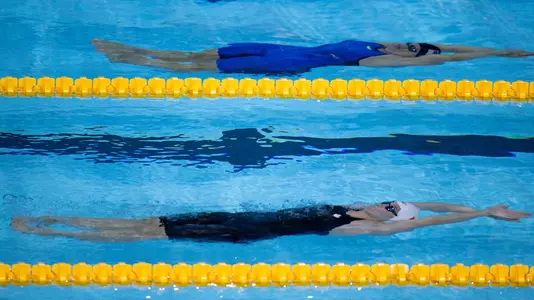 Madison Broad CAN (white cap) and Rhyan White USA (black cap) compete in the Swimming Women's 200m Backstroke Final in the Natatorium, Youth Olympic Park. The Youth Olympic Games, Buenos Aires, Argentina, Tuesday 9th October 2018.