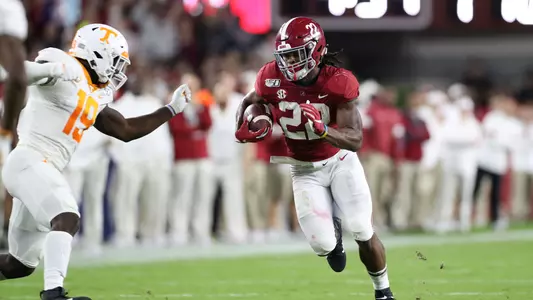 Najee Harris running with football
