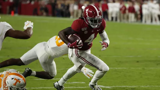 Jerry Jeudy running with football