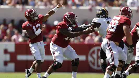 Tua Tagovailoa and Chris Owens