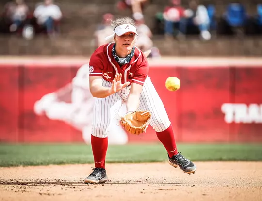 Bailey Dowling bent over ready to catch the ball coming at her glove