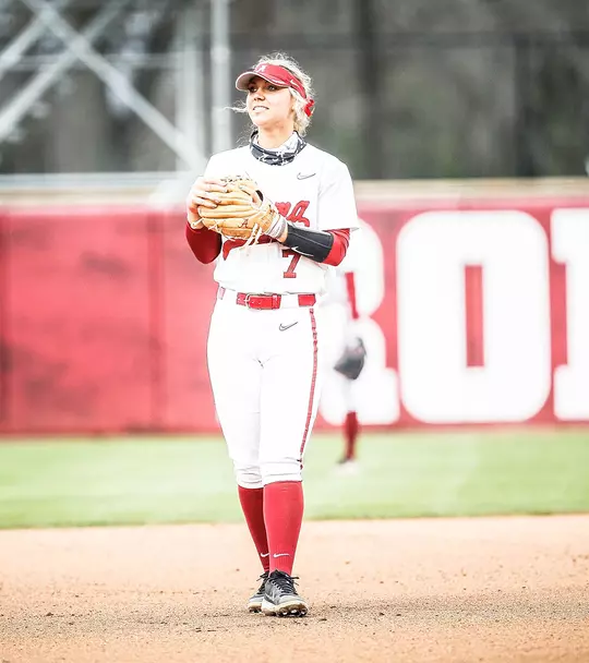 Bailey Dowling looking off into the distance and holding her glove