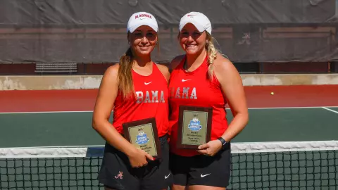 Bencheikh and Hiser with champion plaques