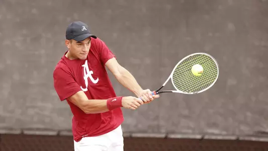 Planinsek hitting the ball