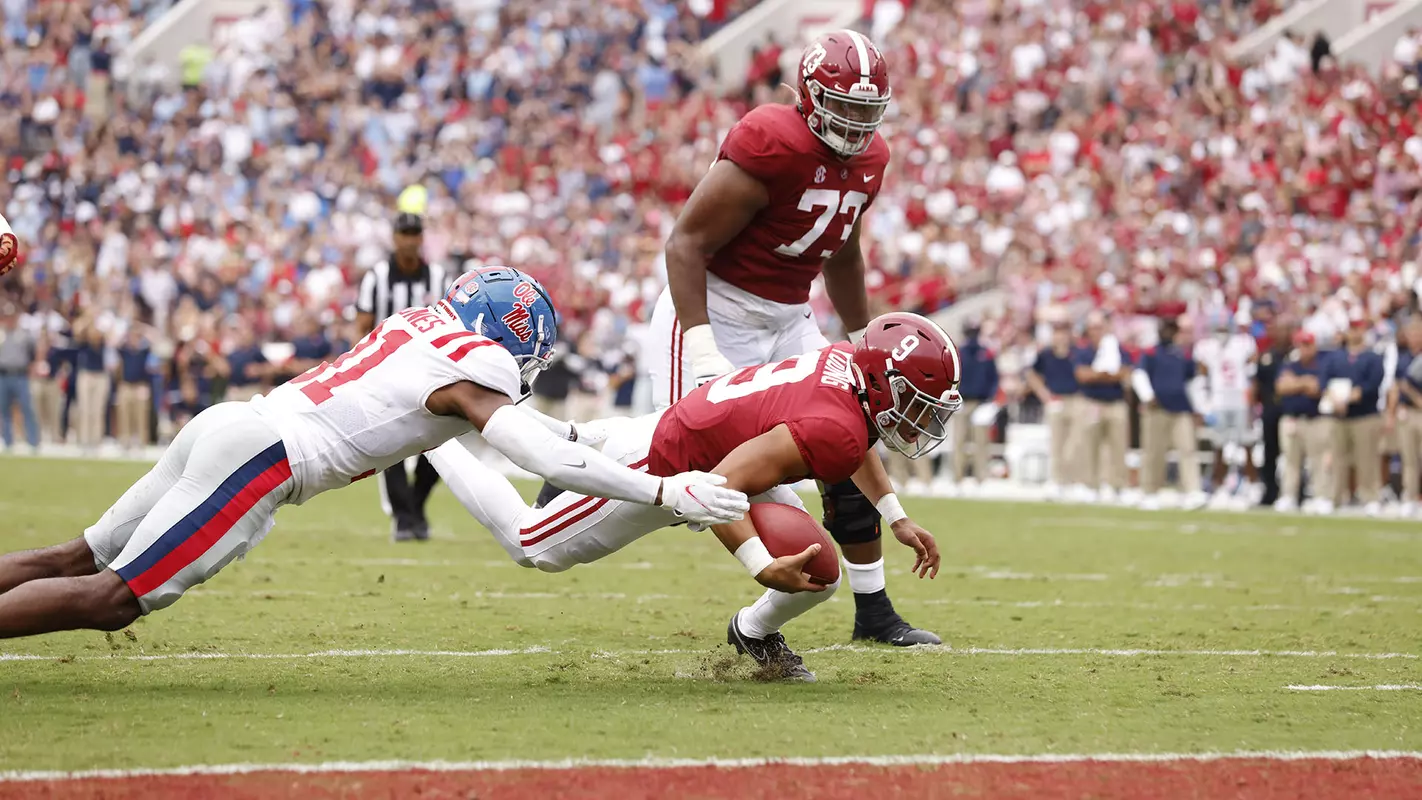 Bryce Young diving with the ball