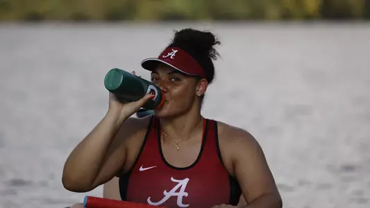 Erica Cunningham drinking water at practice