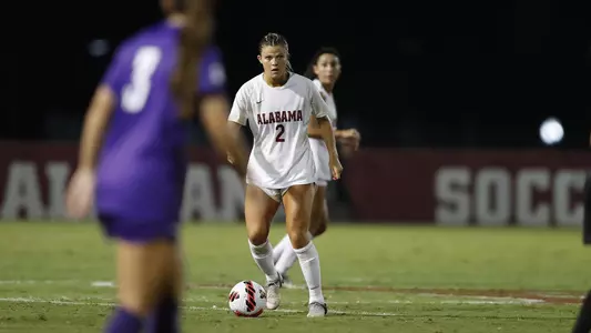 Macy Clem dribbles the ball