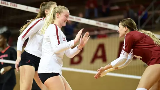 Abby Marjama and Dru Kuck high five