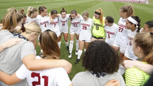 Alabama soccer team huddles prior to kickoff