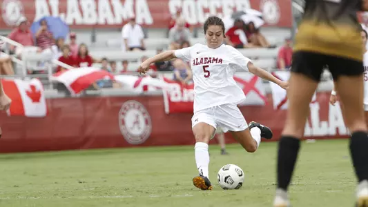 Bella Scaturro kicking the ball