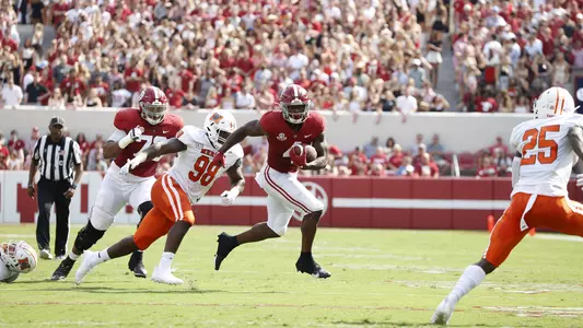 Brian Robinson Jr. carrying the ball down the field