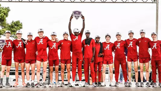 Group shot of the Men's Cross Country team holding the trophy after winning the North Alabama Showcase