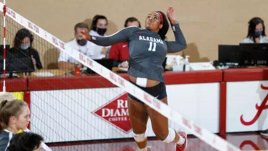 Kennedy Muckelroy attacks the ball against Western Carolina