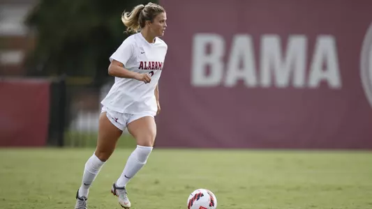 Macy Clem dribbles the ball