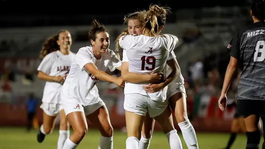 Tanner, Serepca and Rogers celebrate after scoring a goal