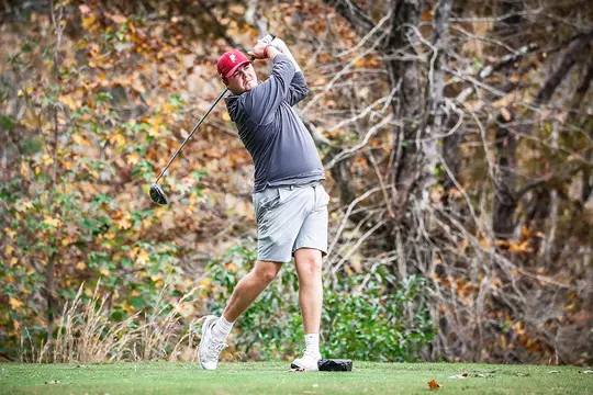 Canon Claycomb holding the golf club after his swing