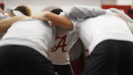 Men's Tennis huddles before match