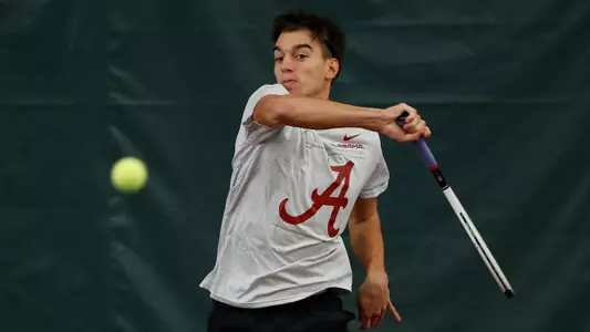Filip PLaninsek hitting the ball