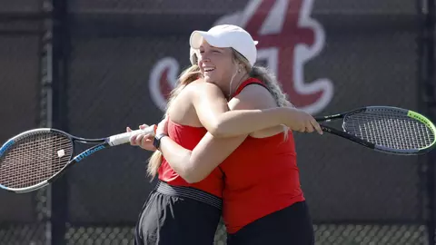 Hiser and Bencheikh hug