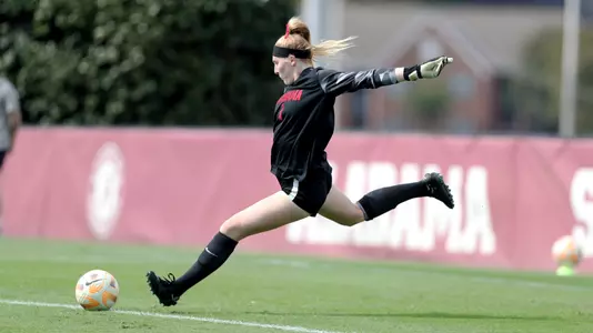 McKinley Crone kicks the ball