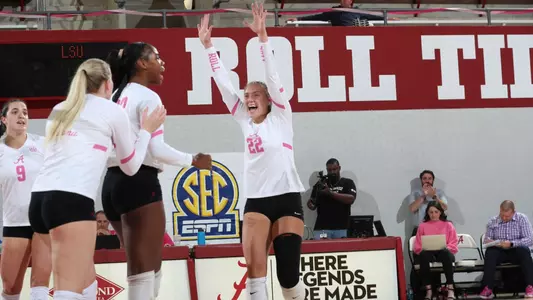 Alabama volleyball player Emily Janek celebrates getting a point with her teammates.