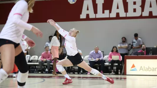 Alabama volleyball player Kendyl Reaugh joyfully hits the ball.