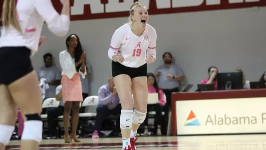 Alabama volleyball player Kendyl Reaugh celebrates getting a point.