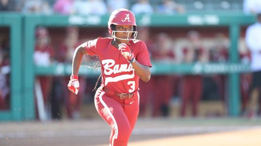 Alabama softball player Kristen White runs on the field.