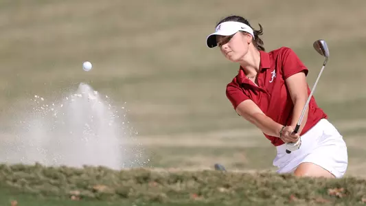 Benedetta Moresco plays out of the bunker during a practice round