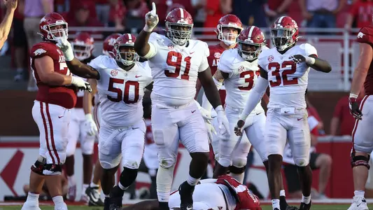 Alabama defensive lineman Jaheim Oatis (91) celebrates a tackle against Arkansas  at Donald W. Reynolds Razorback Stadium in Fayetteville, AR on Saturday, Oct 1, 2022.