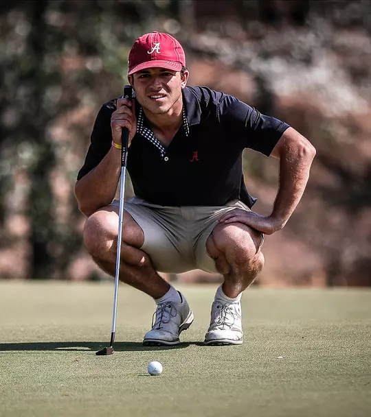 Jack Goldasich bent down to evaluate a shot