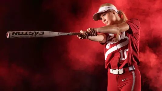 Alabama softball player Abby Duscherer poses with bat.