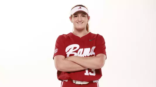 Marlie Giles smiling with arms crossed pose