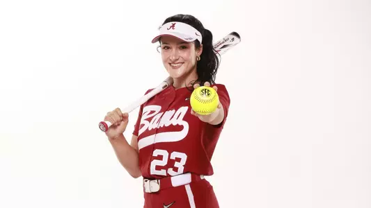 Faith Hensley smiling holding a ball pose